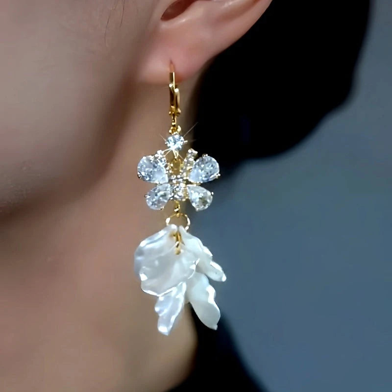 Close-up detail of the sparkling zircons and plating on the Gold Tassel Earrings