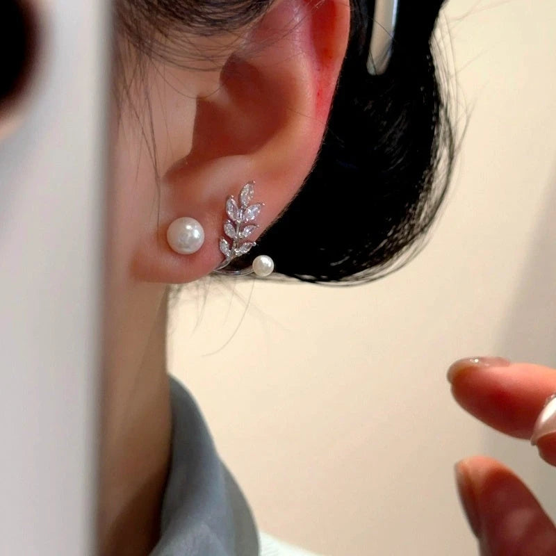 Close-up detail of the sparkling zircons and plating on the Pearl Jacket Earrings