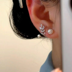 Angled view of the 14K Gold-Plated Elegant Zircon DIamond Wheat Pearl Jacket Earrings