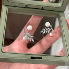 Model showcasing the dangle and style of the 14K Gold-Plated Elegant Zircon DIamond Wheat Pearl Jacket Earrings