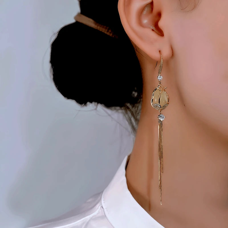 Close-up detail of the sparkling zircons and plating on the Tulip Tassel Earrings