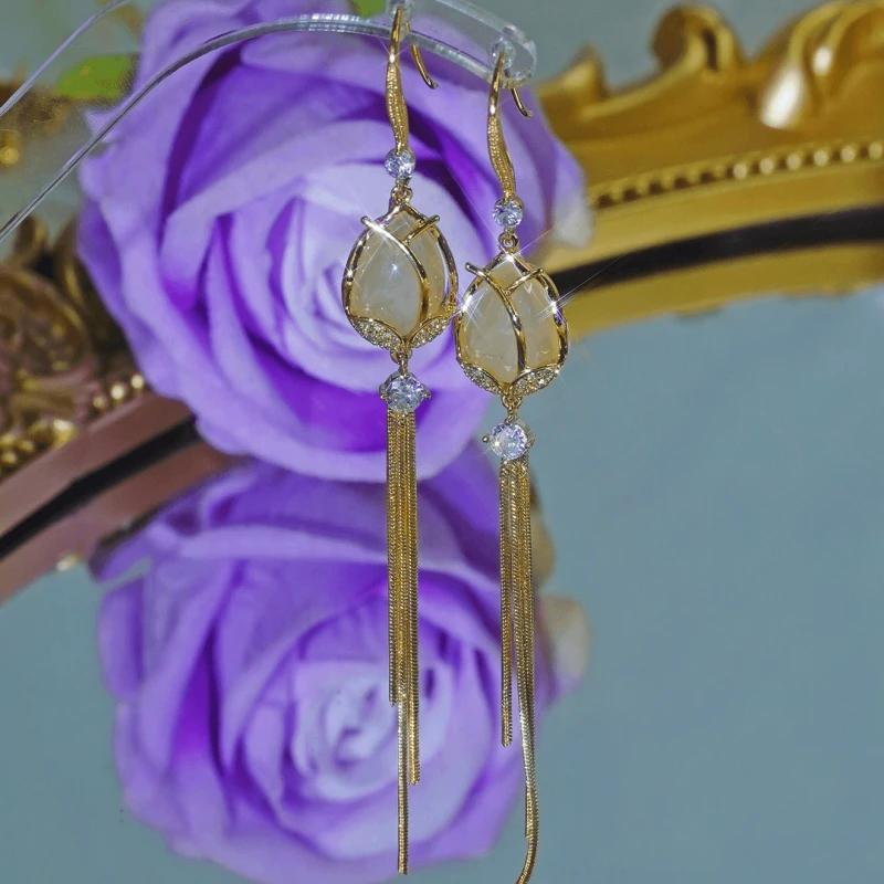 Angled view of the 14K Gold-Plated Elegant Zircon Diamod Tulip Ear Hook Tassel Earrings