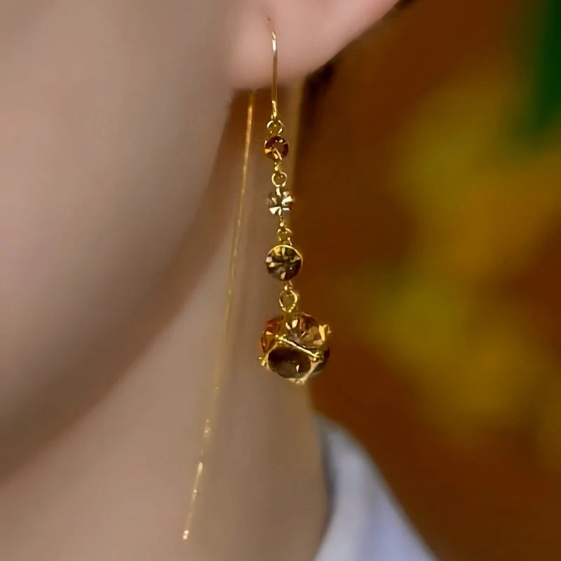 Close-up detail of the sparkling zircons and plating on the Ball Threader Earrings