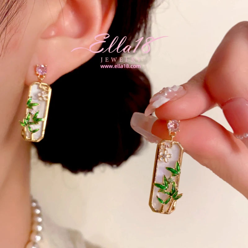 Close-up detail of the sparkling zircons and plating on the Bamboo Leaf Earrings