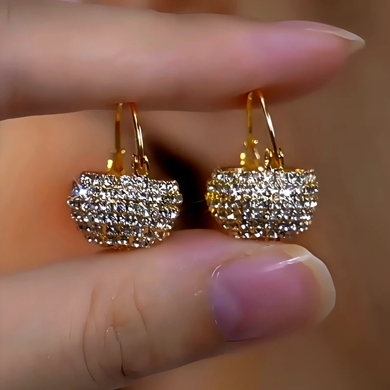 Close-up detail of the sparkling zircons and plating on the Basket Earrings