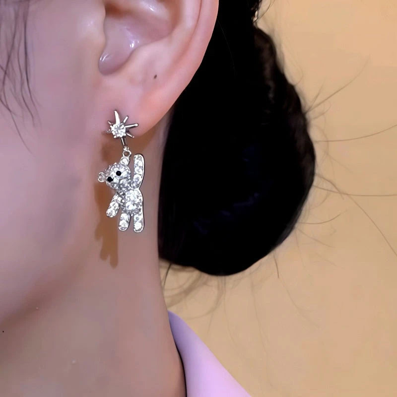 Close-up detail of the sparkling zircons and plating on the Star Tassel Earrings