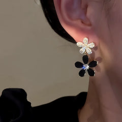Close-up detail of the sparkling zircons and plating on the Black Flower Earrings