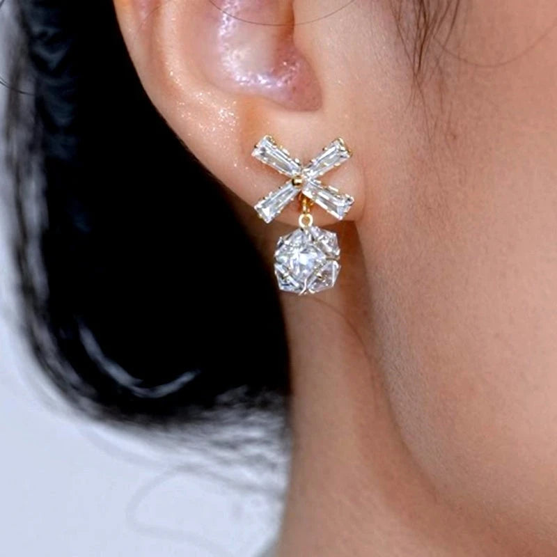 Close-up detail of the sparkling zircons and plating on the Bow Ball Earrings