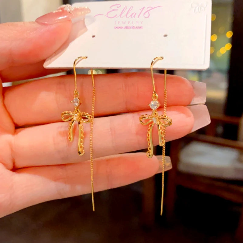 Close-up detail of the sparkling zircons and plating on the Bow Threader Earrings