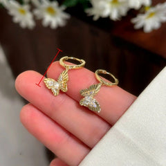 Model showcasing the dangle and style of the 14K Gold-Plated Elegant Zircon Diamond Butterfly Earrings