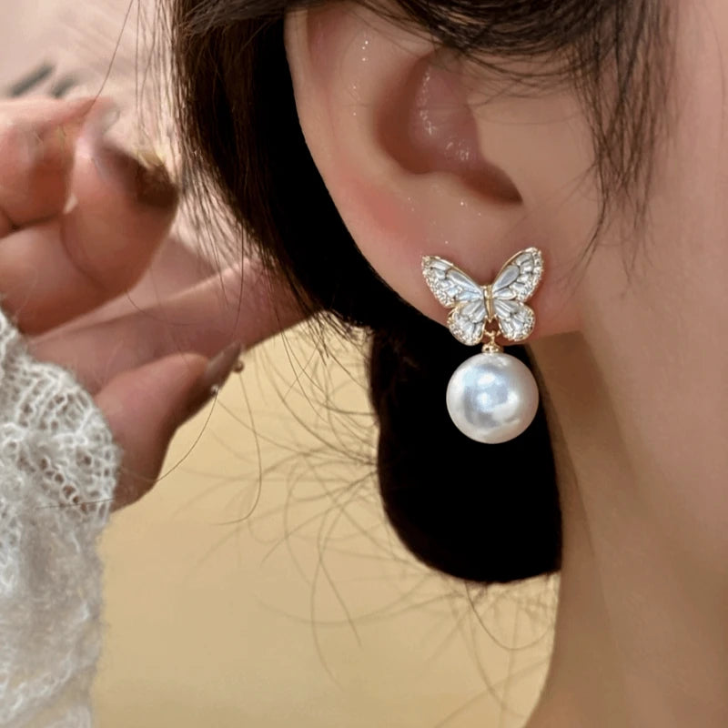 Close-up detail of the sparkling zircons and plating on the Butterfly Tassel Earrings