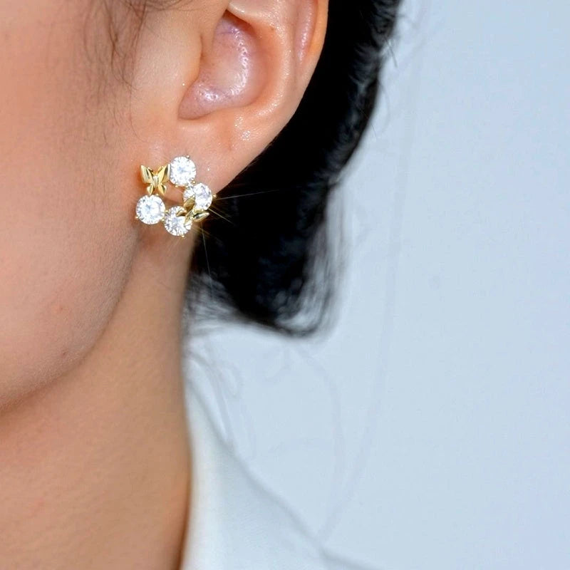 Model showcasing the dangle and style of the 14K Gold-Plated Elegant Zircon Diamond Butterfly Stud Earrings