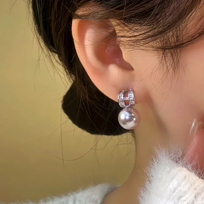 Close-up detail of the sparkling zircons and plating on the C-Shaped Earrings