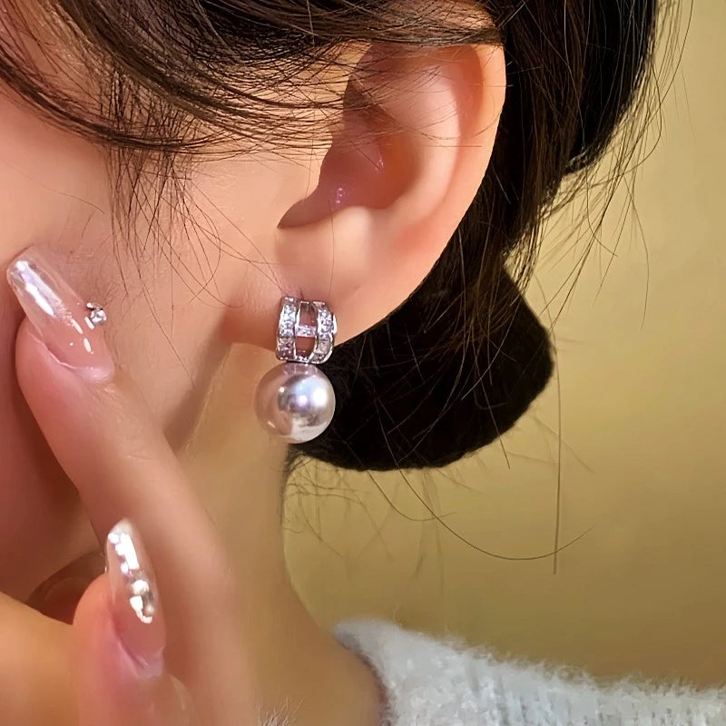 Model showcasing the dangle and style of the 14K Gold-Plated Elegant Zircon Diamond C-Shaped Earrings