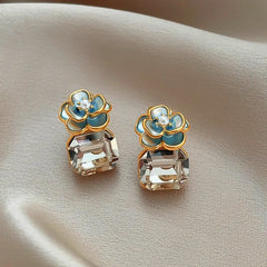Close-up detail of the sparkling zircons and plating on the Camellia Flower Earrings
