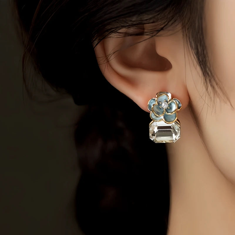 Angled view of the 14K Gold-Plated Elegant Zircon Diamond Camellia Flower Earrings