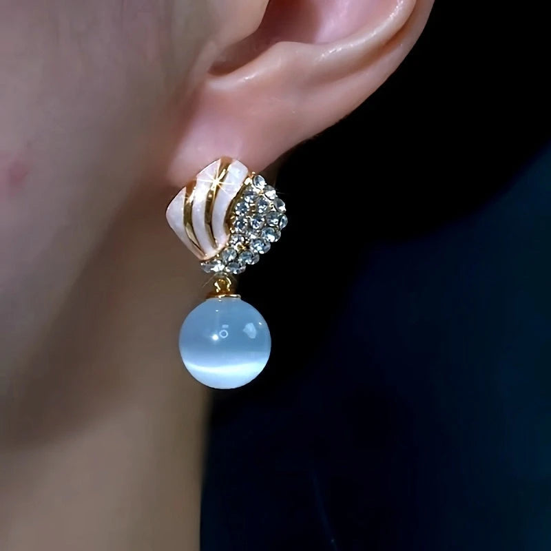 Close-up detail of the sparkling zircons and plating on the Tassel Earrings