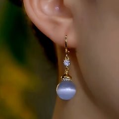Close-up detail of the sparkling zircons and plating on the Cat's Eye Earrings