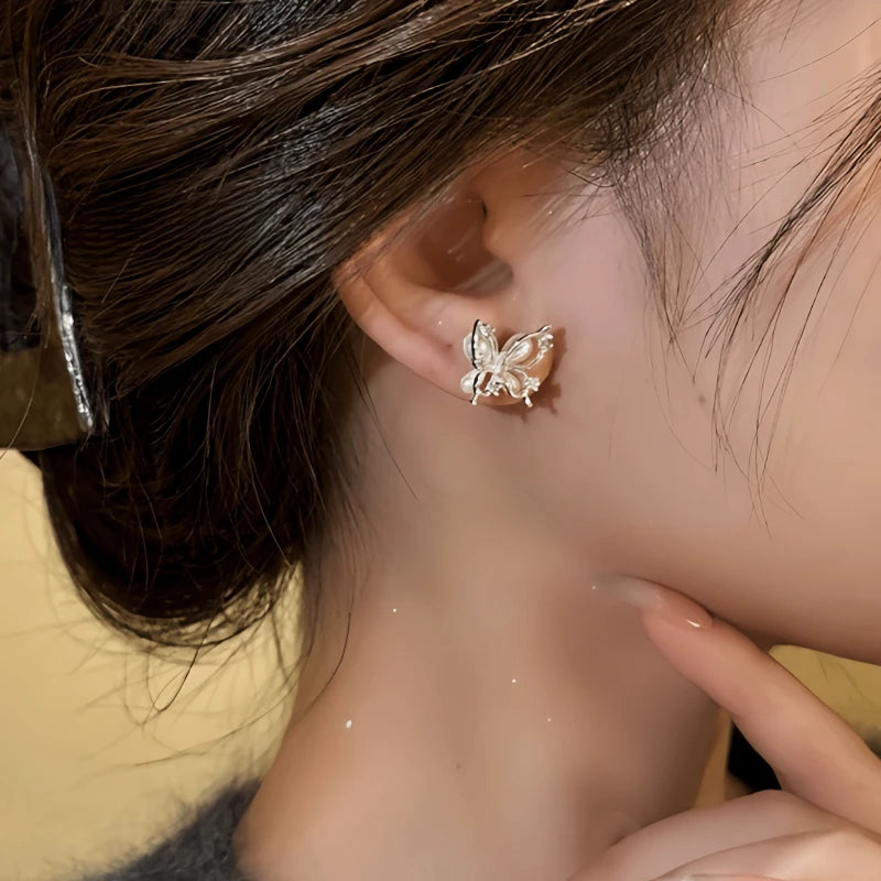 Close-up detail of the sparkling zircons and plating on the Butterfly Stud Earrings