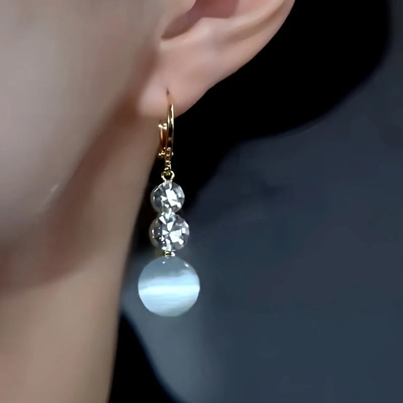 Close-up detail of the sparkling zircons and plating on the Green Cat's Eye Earrings