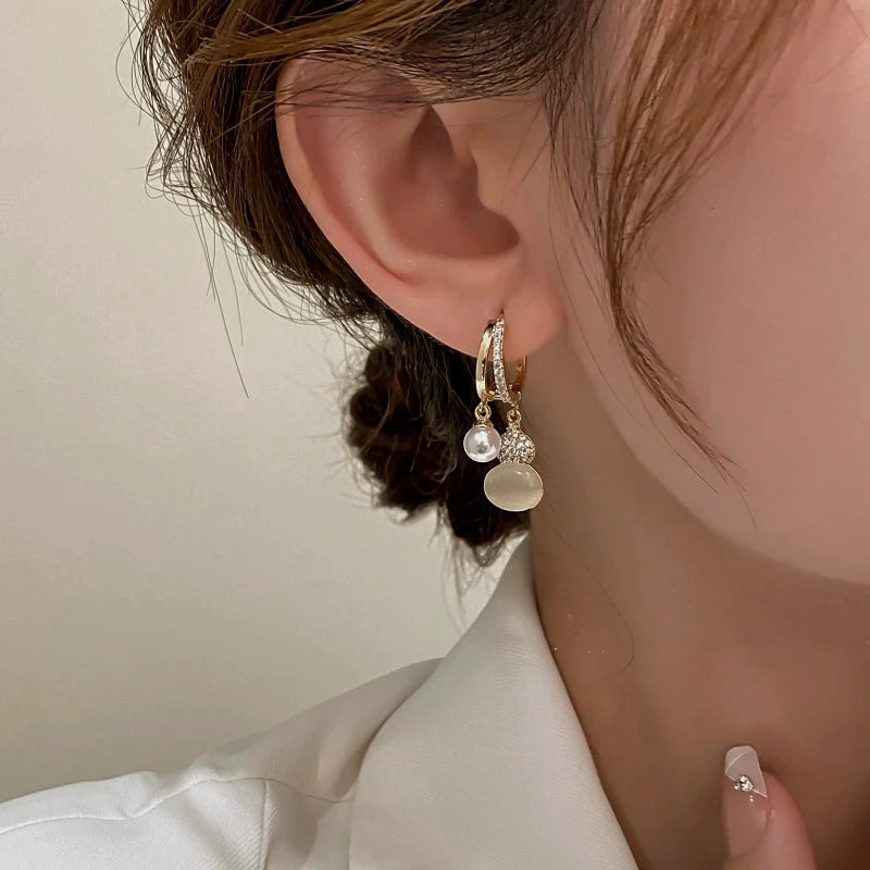 Close-up detail of the sparkling zircons and plating on the Gourd Earrings