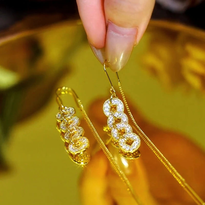 Close-up detail of the sparkling zircons and plating on the Tassel Threader Earrings