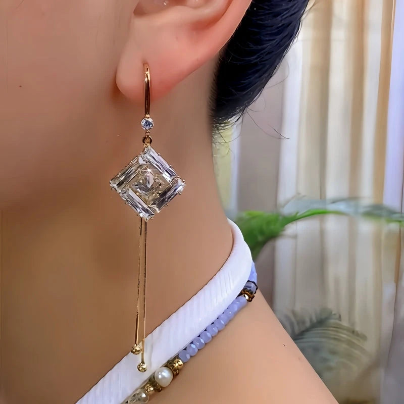 Model showcasing the dangle and style of the 14K Gold-Plated Elegant Zircon Diamond Ear Hook Earrings