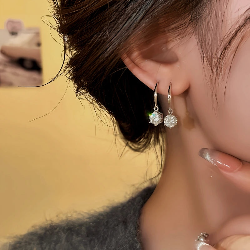 Model showcasing the dangle and style of the 14K Gold-Plated Elegant Zircon Diamond Ear Hooks