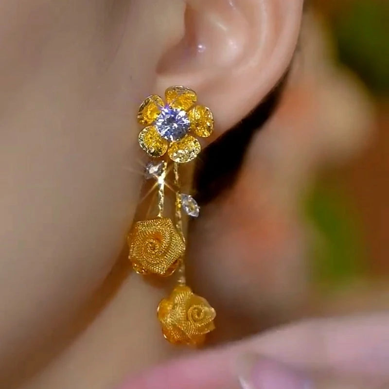 Close-up detail of the sparkling zircons and plating on the Rose Tassel Earrings