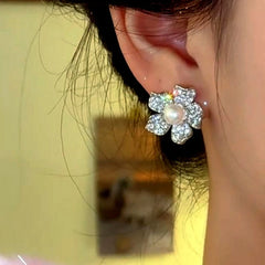 Close-up detail of the sparkling zircons and plating on the Pearl Stud Earrings