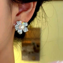 Angled view of the 14K Gold-Plated Elegant Zircon Diamond Flower Pearl Stud Earrings