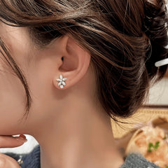 Close-up detail of the sparkling zircons and plating on the Flower Stud Earrings