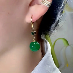 Close-up detail of the sparkling zircons and plating on the Green Bead Earrings