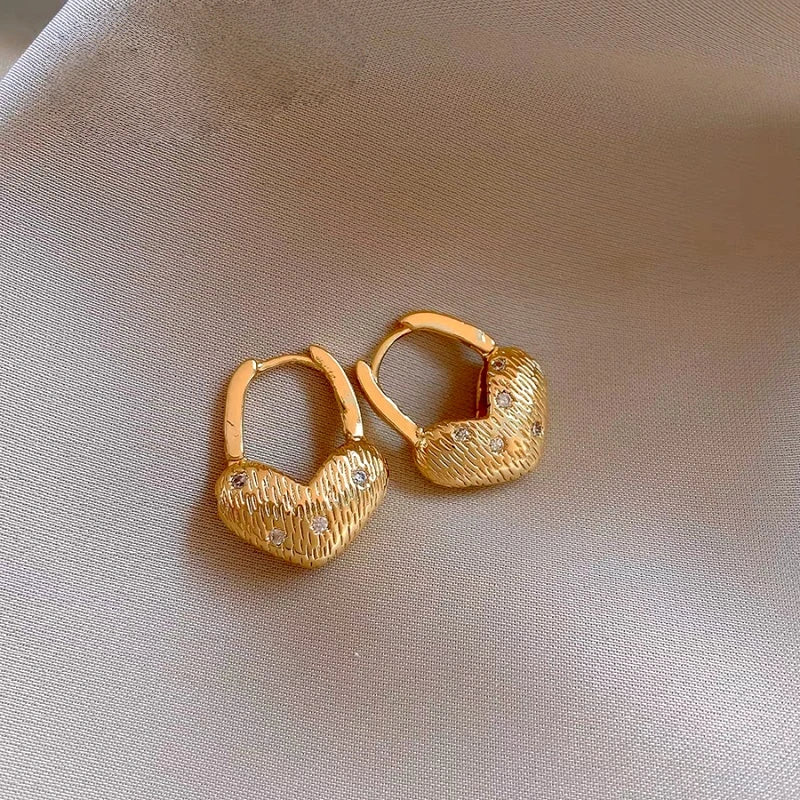 Angled view of the 14K Gold-Plated Elegant Zircon Diamond Heart Earrings