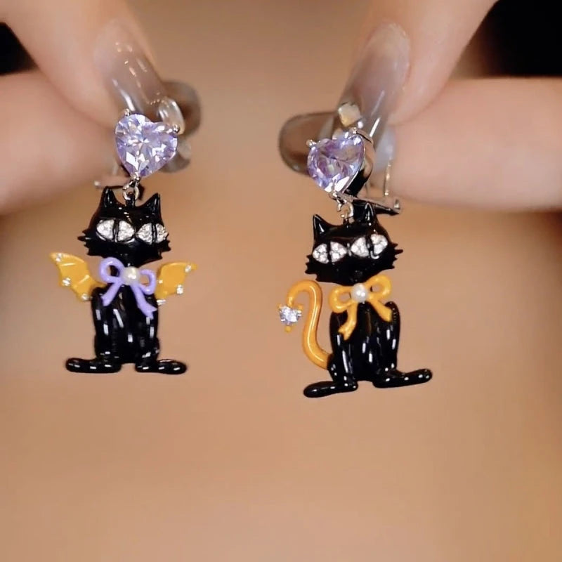 Angled view of the 14K Gold-Plated Elegant Zircon Diamond Heart Halloween Kitty Earrings