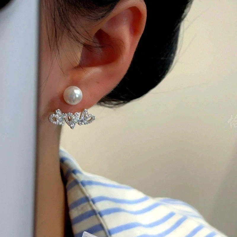 Close-up detail of the sparkling zircons and plating on the Pearl Jacket Earrings