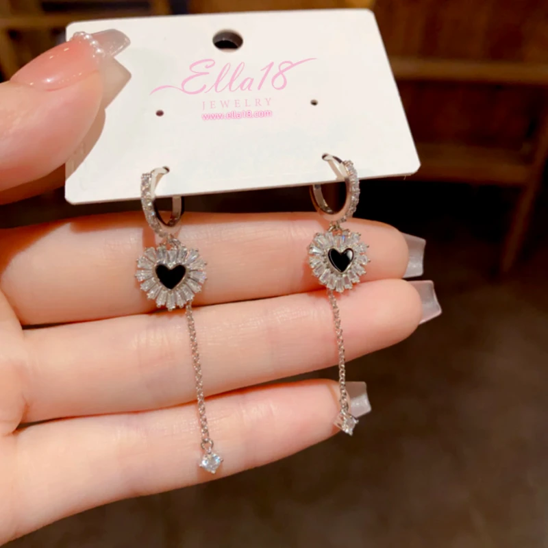 Close-up detail of the sparkling zircons and plating on the Heart Tassel Earrings