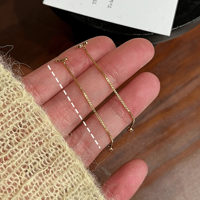 Angled view of the 14K Gold-Plated Elegant Zircon Diamond Heart Threader Earrings