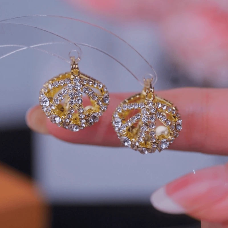 Angled view of the 14K Gold-Plated Elegant Zircon Diamond Hollow Cradle Earrings