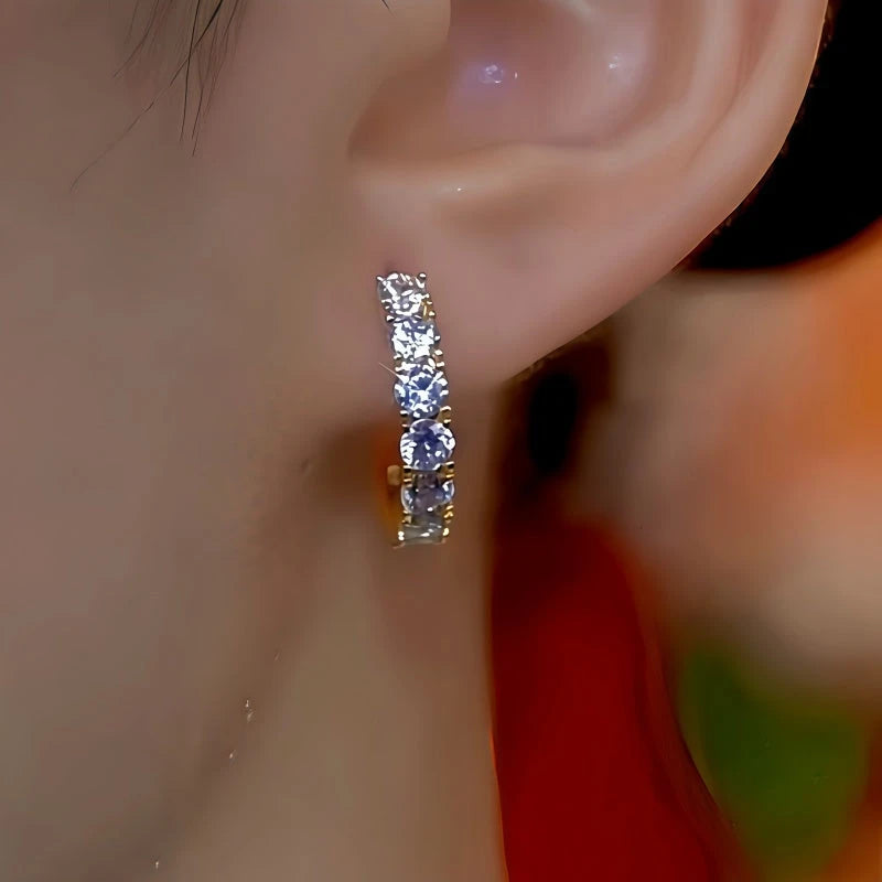 Model showcasing the dangle and style of the 14K Gold-Plated Elegant Zircon Diamond Hoop Earrings
