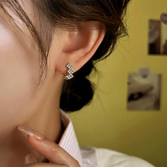 Model showcasing the dangle and style of the 14K Gold-Plated Elegant Zircon Diamond Hoop Earrings