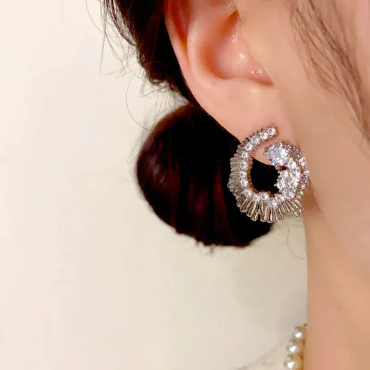 Model showcasing the dangle and style of the 14K Gold-Plated Elegant Zircon Diamond Irregular Earrings