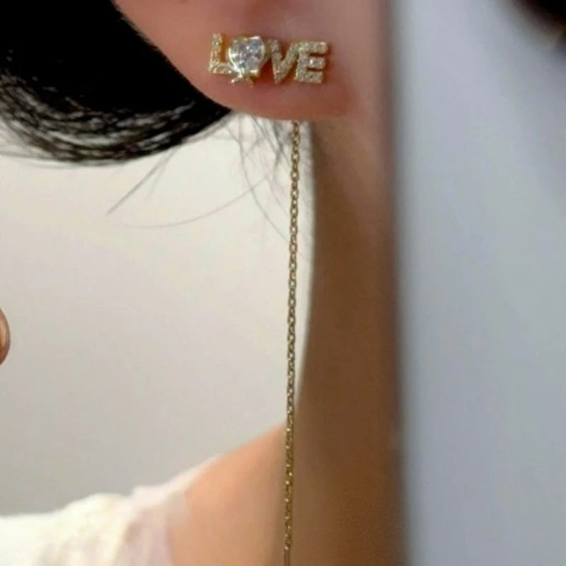 Close-up detail of the sparkling zircons and plating on the LOVE Threader Earrings