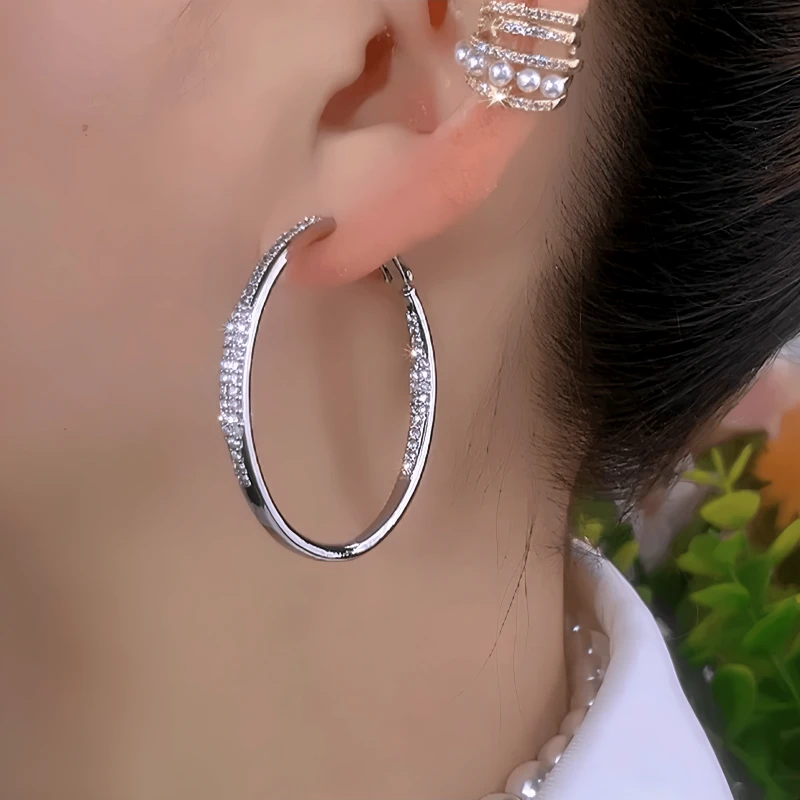 Model showcasing the dangle and style of the 14K Gold-Plated Elegant Zircon Diamond Large Hoop Earrings