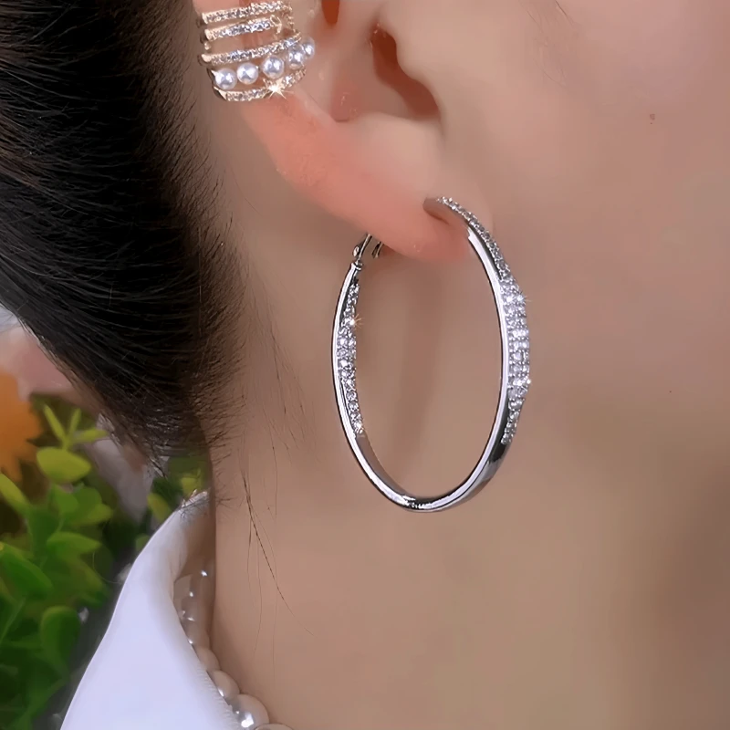 Close-up detail of the sparkling zircons and plating on the Large Hoop Earrings