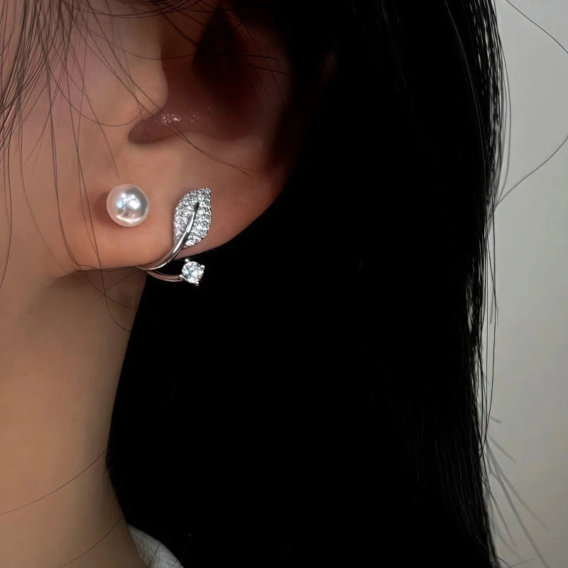 Close-up detail of the sparkling zircons and plating on the Leaf Jacket Earrings