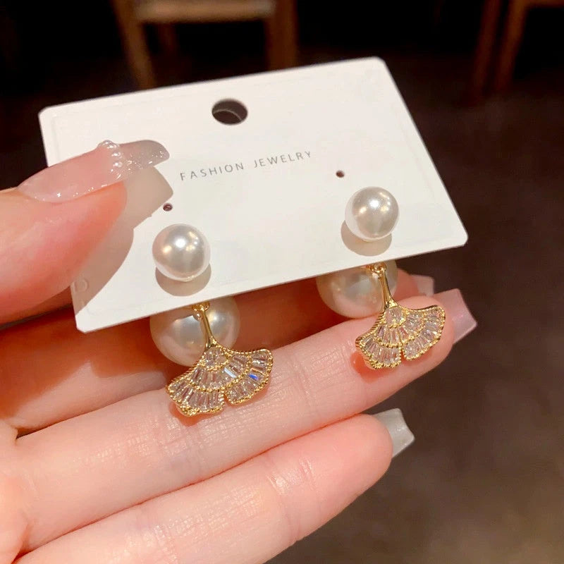 Close-up detail of the sparkling zircons and plating on the Pearl Jacket Earrings