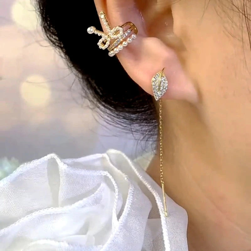 Model showcasing the dangle and style of the 14K Gold-Plated Elegant Zircon Diamond Leaf Threader Earrings