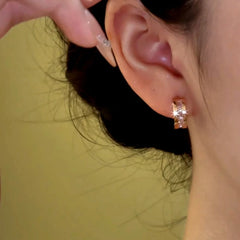 Close-up detail of the sparkling zircons and plating on the Rose Gold Hoops