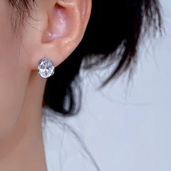 Model showcasing the dangle and style of the 14K Gold-Plated Elegant Zircon Diamond Little Hoop Earrings